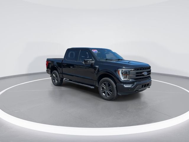 2023 Ford F-150 Lariat in Black Metallic — front three-quarter view