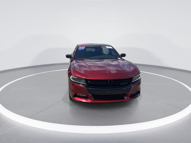 2023 Dodge Charger SXT in Octane Red Pearlcoat — front three-quarter view